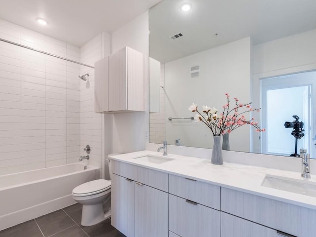 4802 S Congress Ave Unit 310, Austin, TX 78745 - full bath with tile patterned floors, double vanity, and shower / bathtub combination