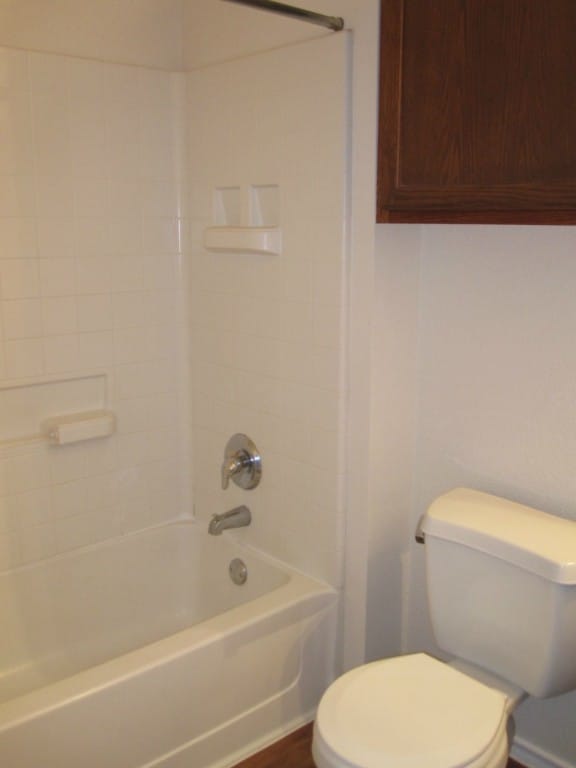 6708 Ferrystone Pass, Del Valle, TX 78617 - bathroom featuring toilet and shower / bathtub combination