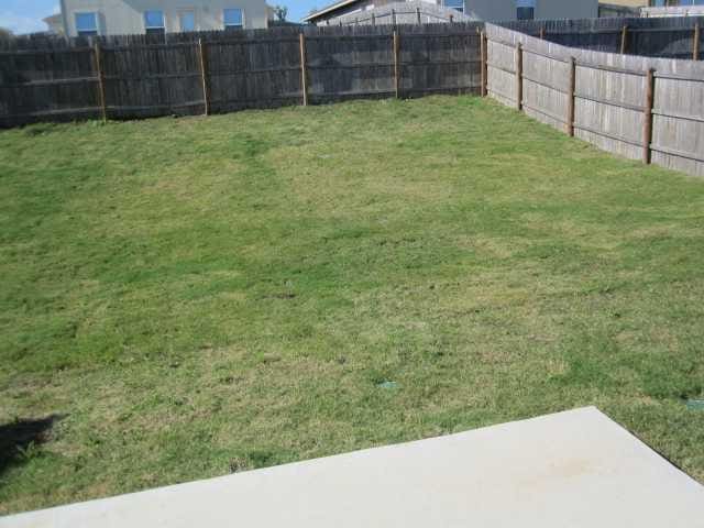 6708 Ferrystone Pass, Del Valle, TX 78617 - view of yard featuring a patio