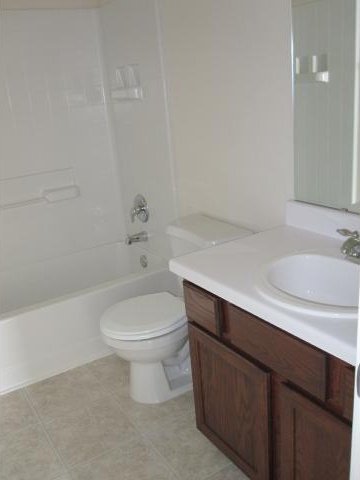6708 Ferrystone Pass, Del Valle, TX 78617 - full bath with vanity, toilet, shower / washtub combination, and tile patterned flooring