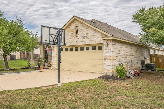 1918 Sand Creek Rd, Cedar Park, TX 78613 - garage with driveway and central AC unit
