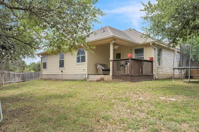 1918 Sand Creek Rd, Cedar Park, TX 78613 - rear view of house with a trampoline and a wooden deck