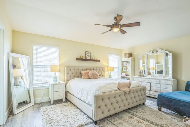 1918 Sand Creek Rd, Cedar Park, TX 78613 - bedroom with multiple windows, wood finished floors, baseboards, and ceiling fan