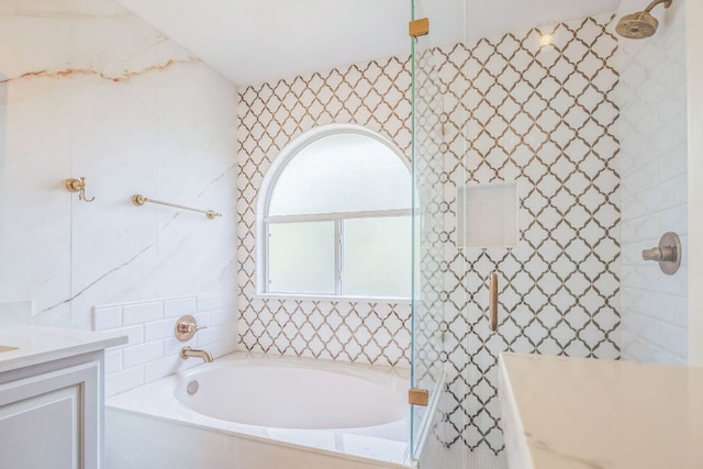 1918 Sand Creek Rd, Cedar Park, TX 78613 - full bath featuring a garden tub, vanity, a tile shower, and tile walls