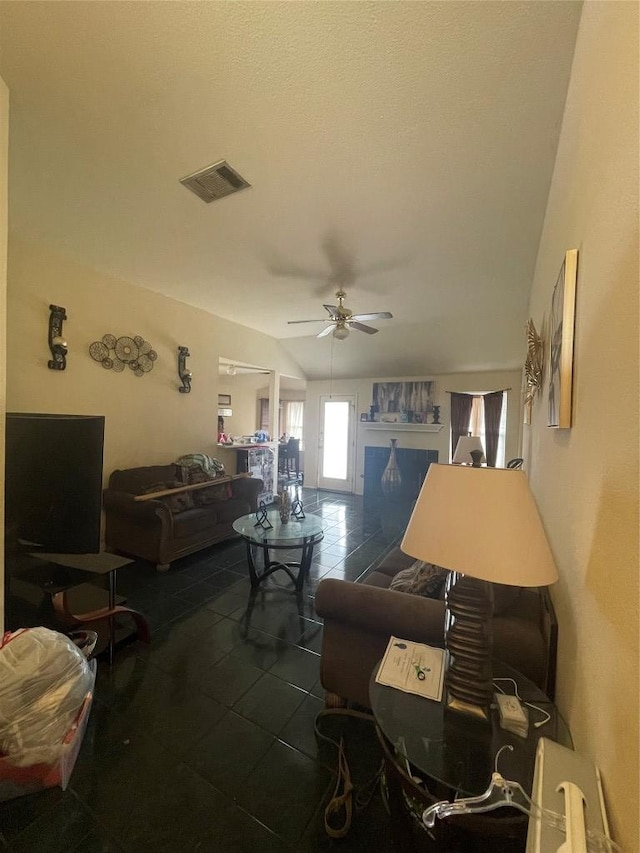 14502 Hartsmith Dr, Austin, TX 78725 - living area featuring a ceiling fan, tile patterned floors, and lofted ceiling