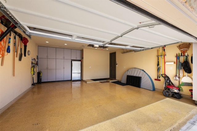 5700 Cherokee Draw Rd, Austin, TX 78738 - garage featuring freestanding refrigerator and a garage door opener