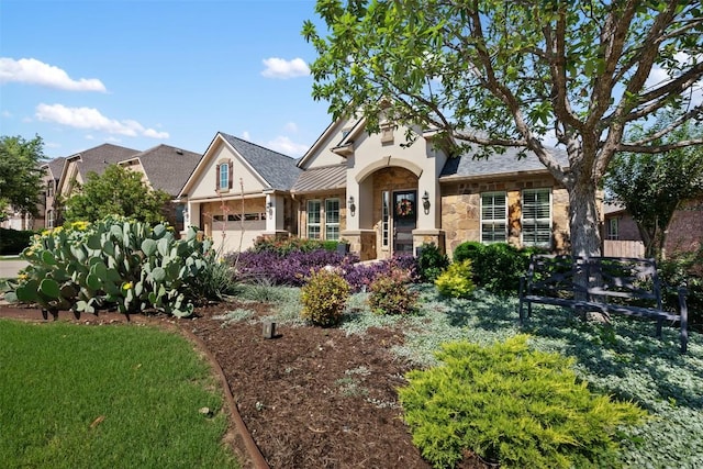 5700 Cherokee Draw Rd, Austin, TX 78738 - view of front of property with stone siding, an attached garage, and stucco siding