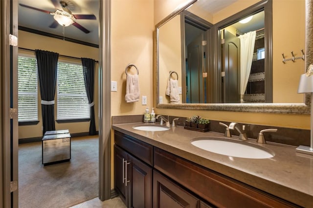 5700 Cherokee Draw Rd, Austin, TX 78738 - bathroom with double vanity, a ceiling fan, tile patterned floors, and crown molding