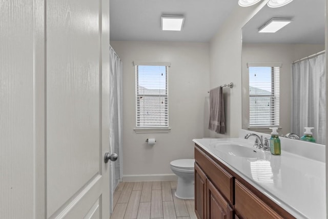 2700 Outlook Ridge Loop, Leander, TX 78641 - bathroom featuring vanity, plenty of natural light, wood finished floors, and curtained shower