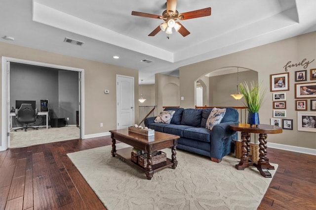 2700 Outlook Ridge Loop, Leander, TX 78641 - living area featuring a tray ceiling, hardwood / wood-style flooring, a desk, a ceiling fan, and recessed lighting