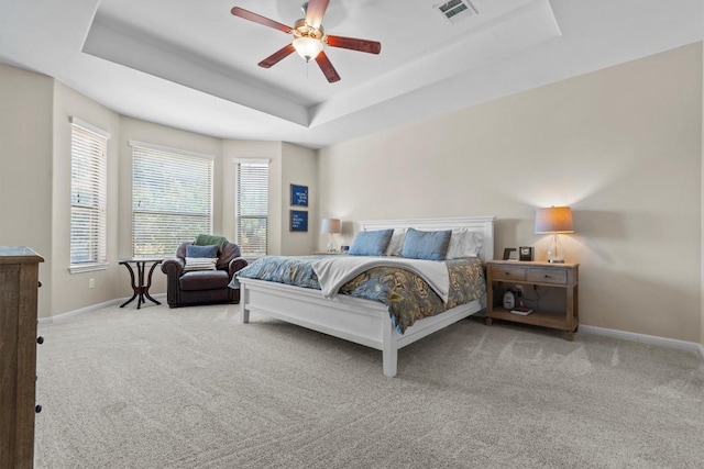 2700 Outlook Ridge Loop, Leander, TX 78641 - carpeted bedroom featuring a raised ceiling and ceiling fan