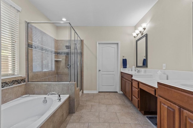 2700 Outlook Ridge Loop, Leander, TX 78641 - bathroom with a bath, double vanity, a stall shower, and tile patterned floors