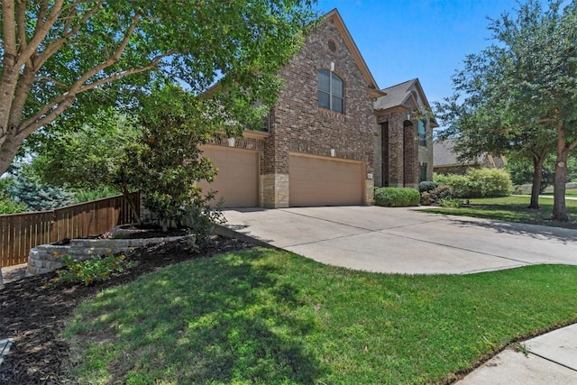2700 Outlook Ridge Loop, Leander, TX 78641 - view of property exterior with driveway, brick siding, an attached garage, and stone siding