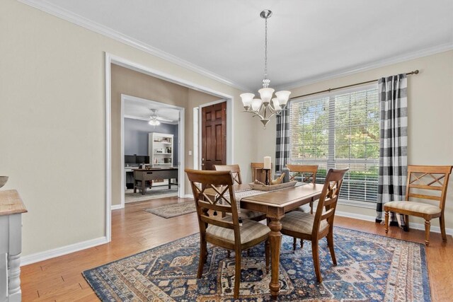 2700 Outlook Ridge Loop, Leander, TX 78641 - dining room with ornamental molding, a chandelier, wood finished floors, and an office area
