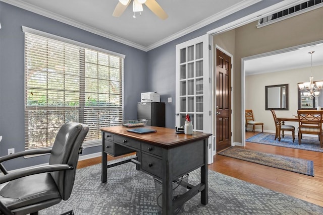 2700 Outlook Ridge Loop, Leander, TX 78641 - home office with a ceiling fan, wood finished floors, ornamental molding, and a chandelier