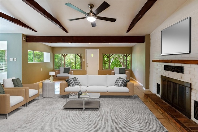 17903 Lafayette Park Rd, Jonestown, TX 78645 - tiled living area featuring beam ceiling, a brick fireplace, a ceiling fan, and baseboards