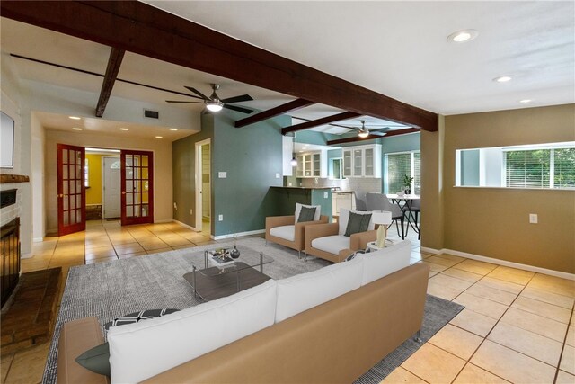 17903 Lafayette Park Rd, Jonestown, TX 78645 - living area featuring ceiling fan, beamed ceiling, tile patterned floors, baseboards, and recessed lighting