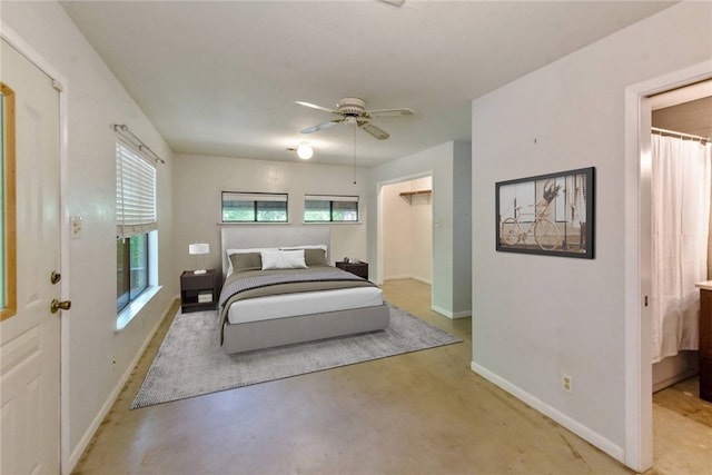 17903 Lafayette Park Rd, Jonestown, TX 78645 - bedroom with baseboards, finished concrete floors, a spacious closet, and a ceiling fan