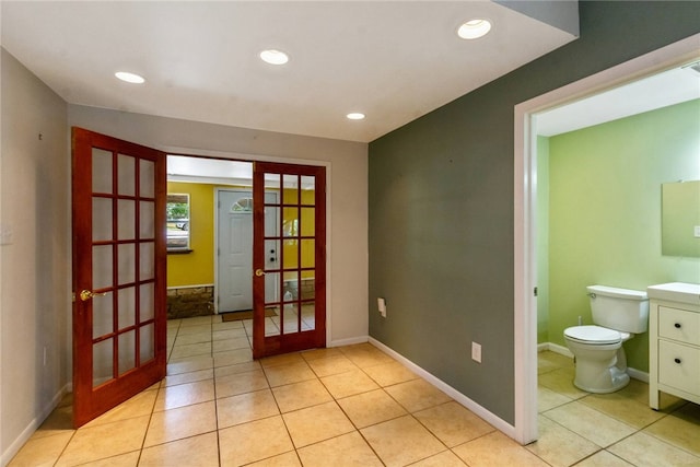 17903 Lafayette Park Rd, Jonestown, TX 78645 - empty room featuring french doors, light tile patterned flooring, baseboards, and recessed lighting