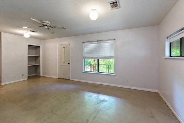 17903 Lafayette Park Rd, Jonestown, TX 78645 - unfurnished room with finished concrete flooring, healthy amount of natural light, and baseboards