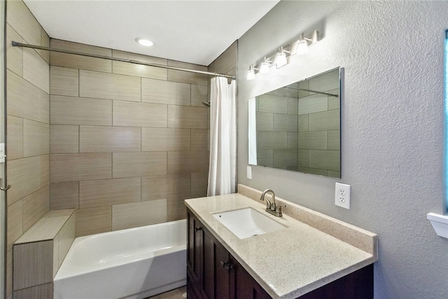 17903 Lafayette Park Rd, Jonestown, TX 78645 - bathroom featuring vanity, shower / bath combination with curtain, and a textured wall