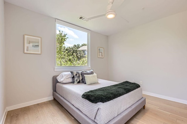 900 S 1st St Unit 212, Austin, TX 78704 - bedroom featuring wood finished floors, baseboards, and ceiling fan
