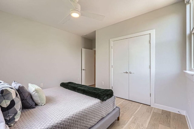 900 S 1st St Unit 212, Austin, TX 78704 - bedroom featuring light wood-style flooring, a ceiling fan, and a closet