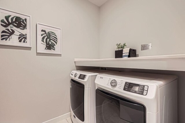 900 S 1st St Unit 212, Austin, TX 78704 - laundry area with washer and clothes dryer and baseboards