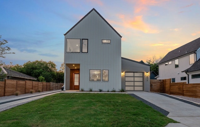 6410 Cannonleague Dr Unit 1, Austin, TX 78745 - contemporary home featuring driveway, an attached garage, and board and batten siding
