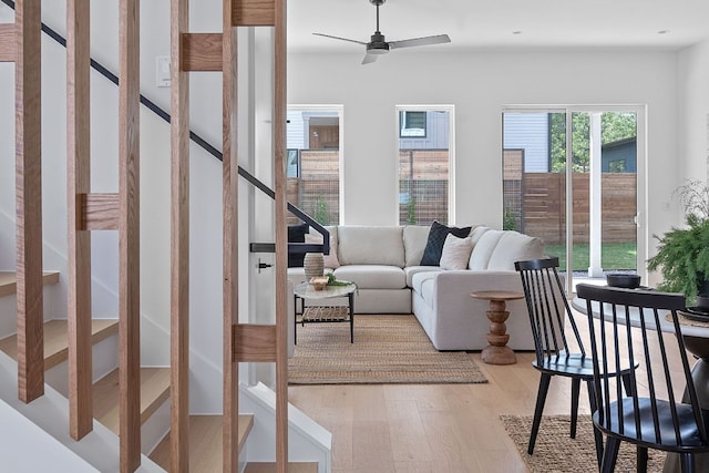 6410 Cannonleague Dr Unit 1, Austin, TX 78745 - living area with light wood-style floors, stairway, and ceiling fan