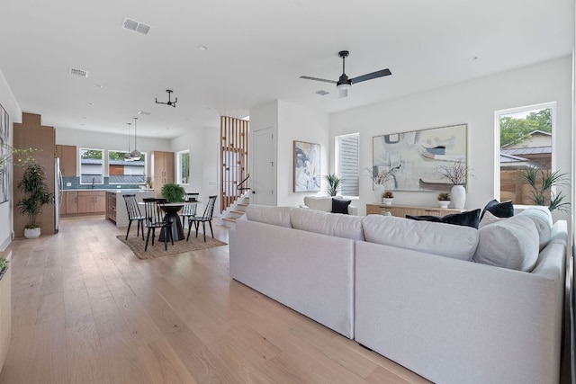6410 Cannonleague Dr Unit 1, Austin, TX 78745 - living room featuring healthy amount of natural light, a ceiling fan, light wood-type flooring, and recessed lighting