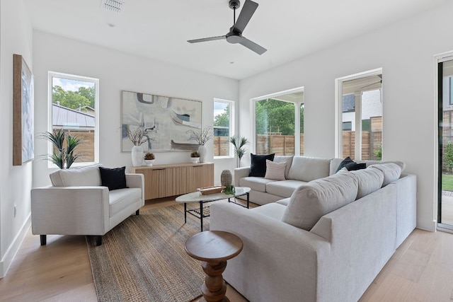 6410 Cannonleague Dr Unit 1, Austin, TX 78745 - living area with light wood-style floors, plenty of natural light, and ceiling fan