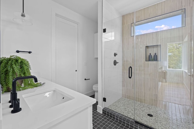 6410 Cannonleague Dr Unit 1, Austin, TX 78745 - bathroom with a stall shower, vanity, toilet, and tile patterned floors