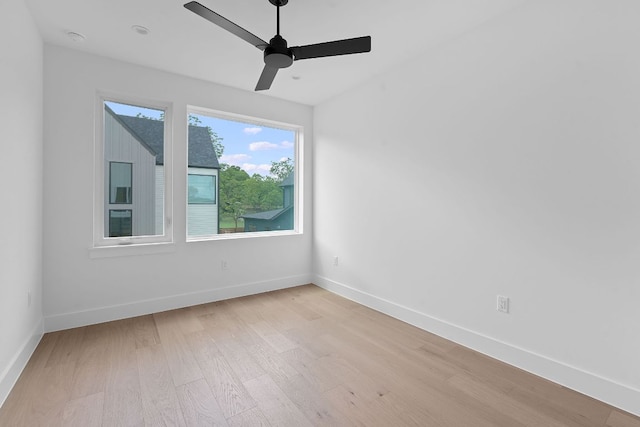 6410 Cannonleague Dr Unit 1, Austin, TX 78745 - unfurnished room with light wood finished floors, ceiling fan, baseboards, and a smoke detector
