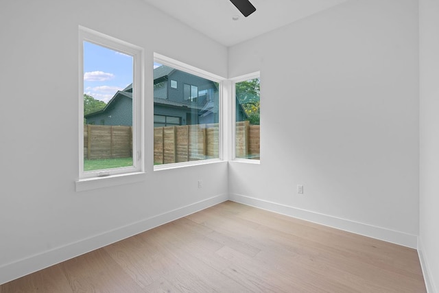 6410 Cannonleague Dr Unit 1, Austin, TX 78745 - unfurnished room featuring light wood-style floors, baseboards, and a ceiling fan