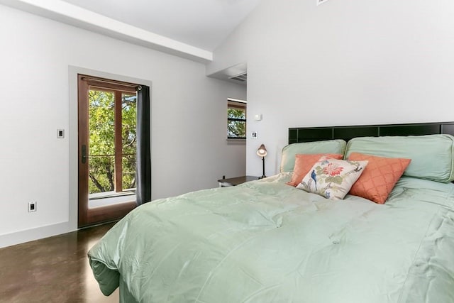 165 Highridge Ln, Fredericksburg, TX 78624 - bedroom featuring finished concrete flooring and vaulted ceiling