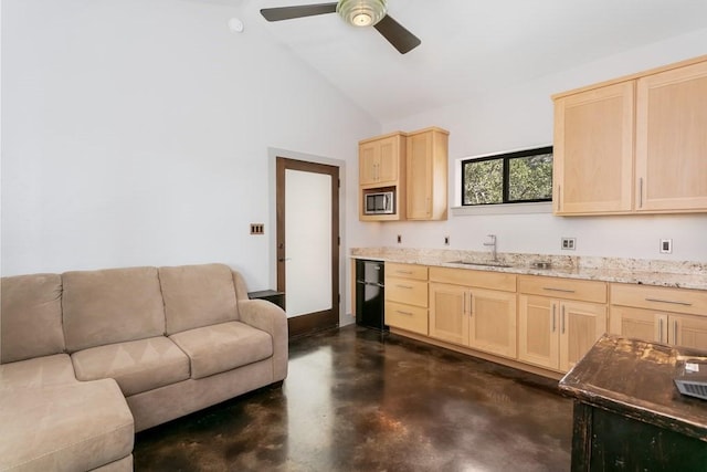 165 Highridge Ln, Fredericksburg, TX 78624 - kitchen featuring light brown cabinetry, stainless steel microwave, concrete floors, open floor plan, and lofted ceiling
