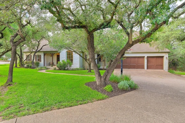 9301 San Lucas Dr, Austin, TX 78737 - view of front of house featuring driveway, an attached garage, a front lawn, and stucco siding