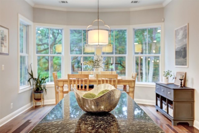 9301 San Lucas Dr, Austin, TX 78737 - dining area with wood finished floors, crown molding, and baseboards