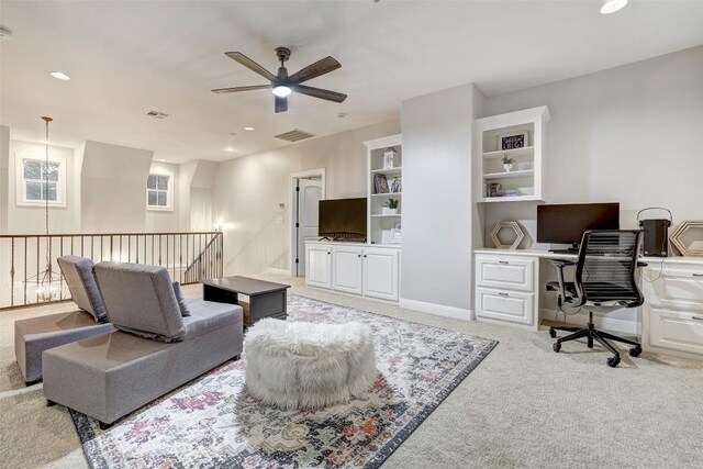 9301 San Lucas Dr, Austin, TX 78737 - living area featuring ceiling fan, an office area, light colored carpet, built in shelves, and recessed lighting