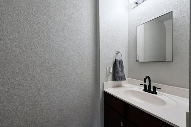 585 Siebert Dr, Kyle, TX 78640 - bathroom with vanity and a textured wall