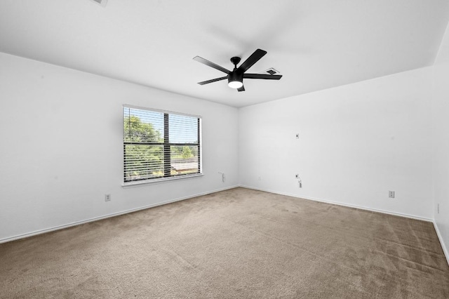 585 Siebert Dr, Kyle, TX 78640 - empty room with carpet floors, a ceiling fan, and baseboards