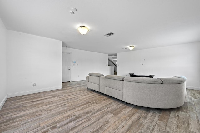 585 Siebert Dr, Kyle, TX 78640 - living room featuring wood finished floors and stairs