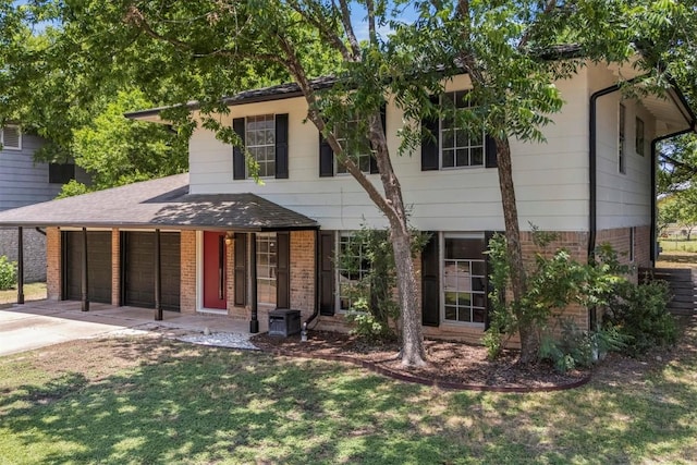 3104 Rexford Dr, Austin, TX 78723 - view of front facade with brick siding, concrete driveway, a front yard, and an attached garage