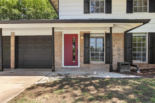 3104 Rexford Dr, Austin, TX 78723 - property entrance featuring a porch, driveway, and brick siding