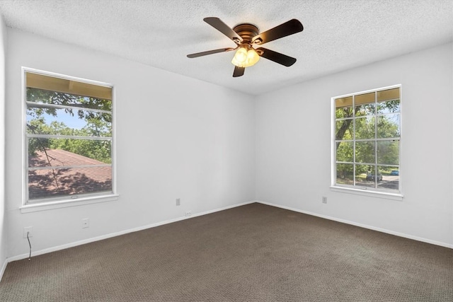 3104 Rexford Dr, Austin, TX 78723 - unfurnished room featuring plenty of natural light, dark colored carpet, a textured ceiling, a ceiling fan, and baseboards