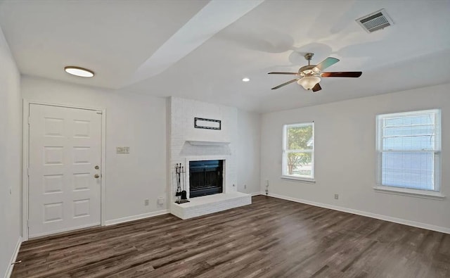 1709 Greenlawn Blvd, Round Rock, TX 78664 - unfurnished living room featuring dark wood finished floors, ceiling fan, baseboards, a fireplace, and recessed lighting