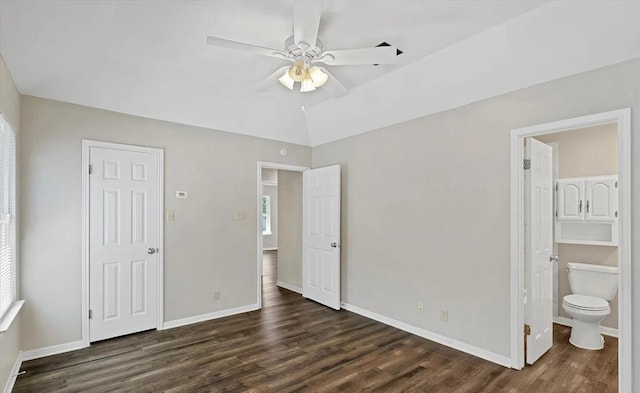 1709 Greenlawn Blvd, Round Rock, TX 78664 - unfurnished bedroom featuring dark wood finished floors, baseboards, connected bathroom, and ceiling fan