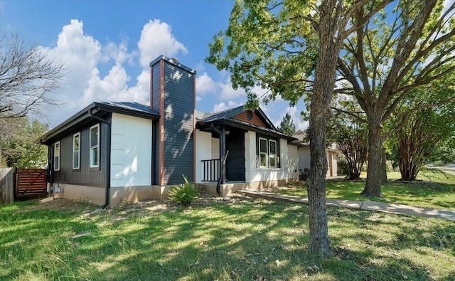 1709 Greenlawn Blvd, Round Rock, TX 78664 - view of front of home featuring a front yard and a chimney