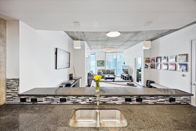 360 Nueces St Unit 3309, Austin, TX 78701 - kitchen featuring a sink, dark countertops, and open floor plan